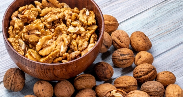 side-view-bowl-with-walnuts-rustic_141793-6221